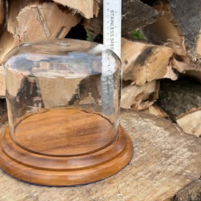 glass holder on wooden plynth